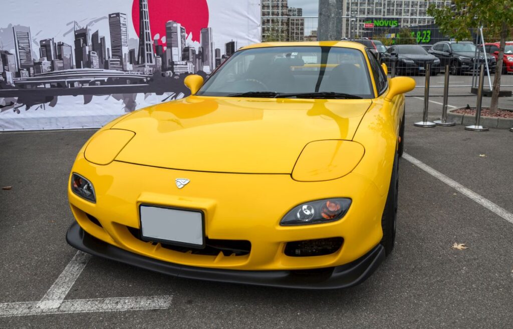 Bright yellow Mazda RX-7 