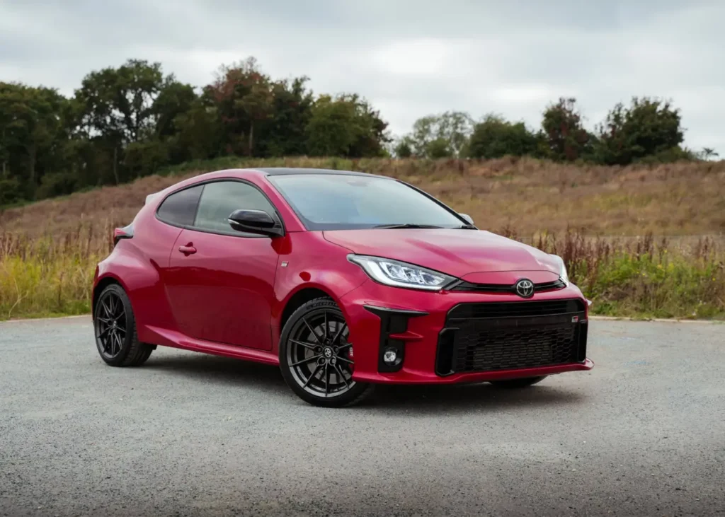 Red Toyota Yaris parked outside