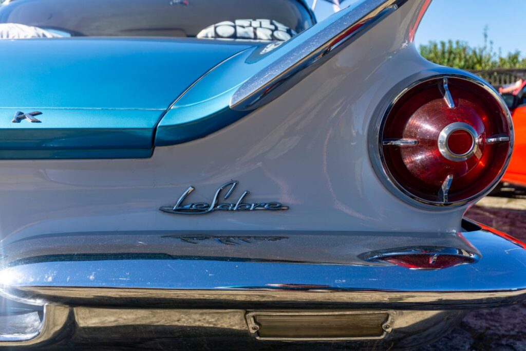 Rear of classic 1950s Buick LeSabre with chrome details and distinctive round tail light design